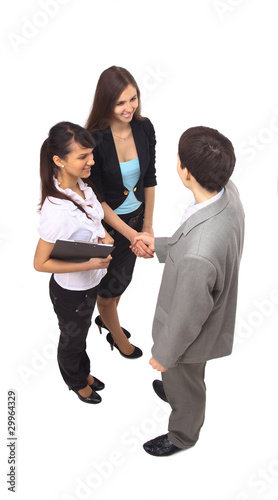 Photo: Business people shaking hands, finishing up a meeting Business people shaking hands, finishing up a meeting