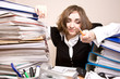 Tired businesswoman with a lot of folders