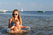 Girl and toddler having fun in the sea