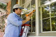 Man Caulking Window Man Caulking Window