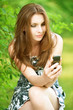 Beautiful young woman with mobile phone