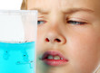 Little boy scrutiny looks into helium aquarium - ant farm