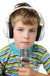 Little boy in striped shirt and headphone with microphone