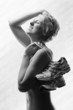 Young, beautiful woman with running shoes