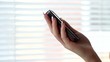 Hand holding modern smart phone