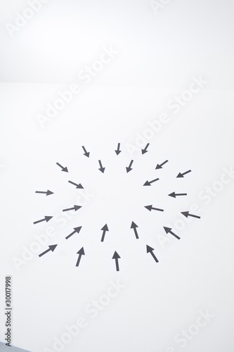 Photo: Arrows pointing into center Arrows pointing into center