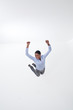 Enthusiastic businesswoman jumping midair