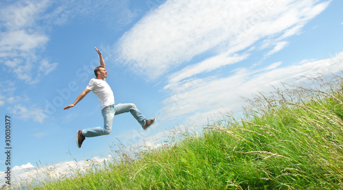 Photo: Man jumping on the meadow Man jumping on the meadow