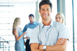 Successful businessman standing with arms crossed