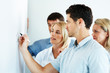 Young businessman giving presentation to his colleague