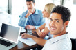 Smart young business executive with colleagues discussing in the Smart young business executive with colleagues discussing in the