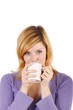 Young woman with a coffee mug (white background) Young woman with a coffee mug (white background)