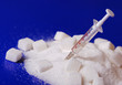 Insulin injection white a pile of sugar Insulin injection white a pile of sugar