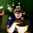 Young man watch the 3d popcorn instead of 3d movie