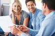 Young couple discussing investment plans with advisor