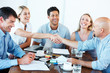 Successful businesspeople shaking hands making a necessary agree