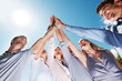 Business team celebrating success with high five