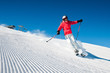 Woman skiing in high mountains - modified piste