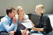 Agent explaning an investment scheme to a couple
