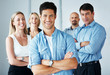 Successful business man with his team in background