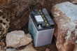 car battery among rocks