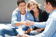 Young couple shaking hand with insurance advisor Young couple shaking hand with insurance advisor