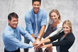 Foto: Unity - Group of business people with hands together Unity - Group of business people with hands together