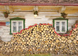 Stack of wood near old cottage windows