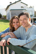 Photo: Portrait of happy new property owners Portrait of happy new property owners