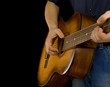 man playing guitar isolated on black