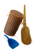 Basket  for garbage,  broom and a dustpan.