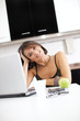 Modern woman reading e-mails at her breakfast