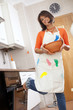 Woman opening the kitchen oven