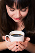 Close-up portrait of a beautiful smiling girl with a cup of coff