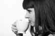 Close-up portrait of a beautiful girl with a cup of coffee
