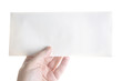 Hand holding a blank envelope