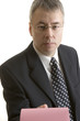 You`re Fired businessman giving pink slip