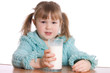 The little girl with a milk glass