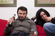 Bored Wife and Arrogant Husband Watching Television