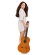 Young beautiful brunette girl in white chemise with acoustic gui