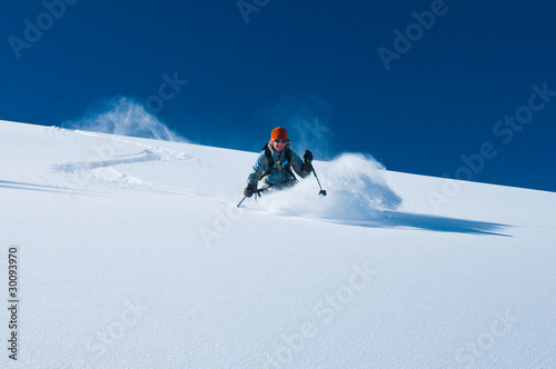 Photo: mature woman skiing un tracked powder snow mature woman skiing un tracked powder snow