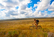 Women with bike on meadow Women with bike on meadow