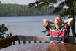 Photo: Man relaxing by a lake Man relaxing by a lake