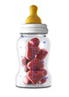 baby feeding bottle fill with hearts (love child concept)