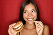 Junk food woman eating burger Junk food woman eating burger