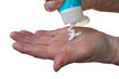Woman pouring hand moisturizer in her hand