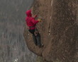 Rock climber zoom in cliff.