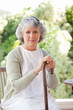 Retired woman with her walking stick