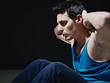 Photo: man doing series of sit-ups on black background man doing series of sit-ups on black background
