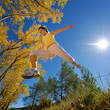 young woman jogging/jumping outdoor in summer